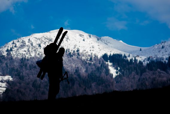 person with skis on mountain.