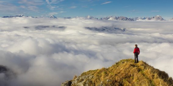 man standing on a mountaintop