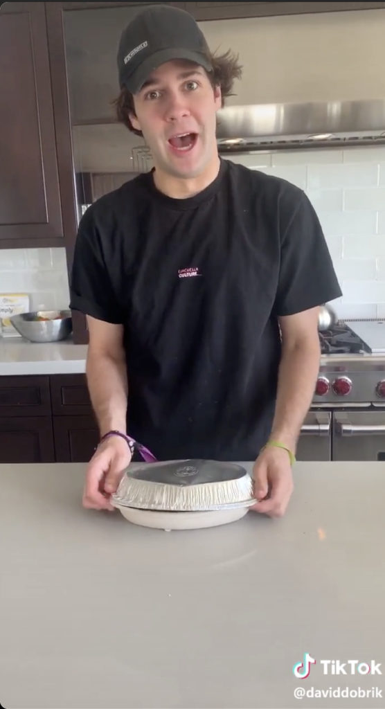 Screenshot of a fan doing chipotle lid flip challenge on TikTok